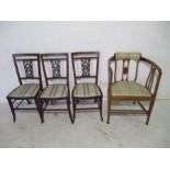 A set of three Edwardian inlaid chairs, along with an Edwardian tub chair