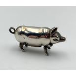 A silver vesta case in the form of a pig