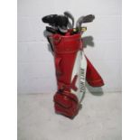 A set of right handed Lowpro golf irons, along with a Bazoka iron-wood and three putters including a