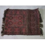 A red ground hand woven prayer rug, 92cm x 71cm