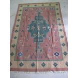 A South American rug with geometric patterns and symbols
