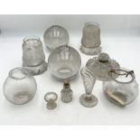 A small collection of antique glassware including lampshades, ink well etc.
