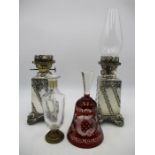 A pair of Walker & Hall silver plated oil lamps with rams head detailing along with a Bohemian glass