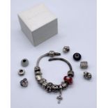 A 925 silver Pandora bracelet and various charms- bracelet A/F