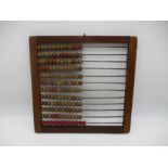 An antique wooden framed abacus