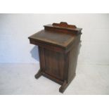 A rosewood veneered Edwardian inlaid davenport