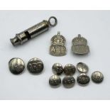 An Air Raid Precaution whistle, two badges and a small collection of buttons.