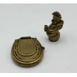 Two novelty brass vesta cases in the forms of a horseshoe and Mr Punch