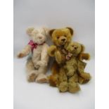 A collection of three vintage collectors teddy bears, all with jointed limbs.