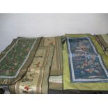 A large collection of oriental embroidery.