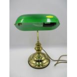 A modern bankers lamp with green shade