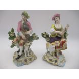 A pair of Sampson porcelain bocage figure groups, one depicting a man in 18th Century dress