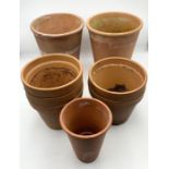 A small collection of terracotta pots including a larger pair
