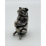 A silver vesta case in the form of a seated pig