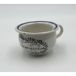 A 19th century miniature chamber pot printed with the verse; Hand it over to me my dear