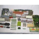 A collection of model railway buildings and scenery including signal box, shops, pub, houses, post