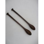 A pair of vintage wooden exercise clubs