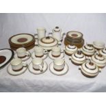 A Denby Stoneware cream and brown part dinner service including a teapot, milk jug, six trios, six