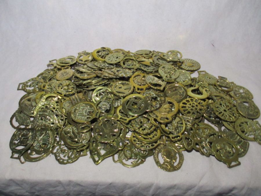 A large collection of horse brasses