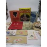 A collection of worldwide stamps, comprises of two albums plus loose stamps. Also includes books