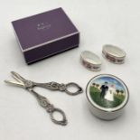 A small collection of items including Asprey stationary set, Royal Crown Derby napkin rings,