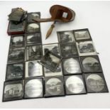 A stereoscopic viewer along with a quantity of magic lantern vintage slides some showing scenes from