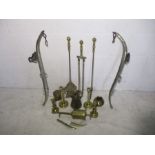 A collection of brass ware including horse hames, candlesticks etc