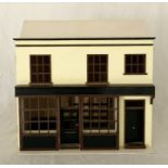 A Honeychurch "18th Century Shop" dolls house with small amount of furniture and kit including