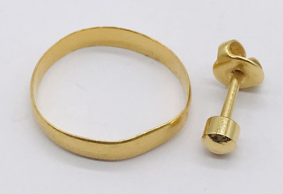 A 22ct gold wedding band (1.5g) along with a single unmarked gold stud earring (0.5g)