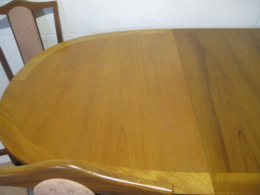 A Nathan extending dining table, along with six matching chairs including two carvers. - Image 7 of 16
