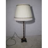 An antique style faux bamboo table lamp