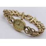 An Accurist 9ct gold watch and strap, total weight 15.9g