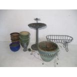 A selection of garden pots and ornaments plus a bird bath and a plant stand.