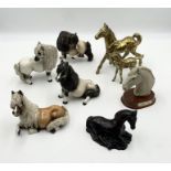 A collection of various horse figurines including brassware and Cheval Ceramics