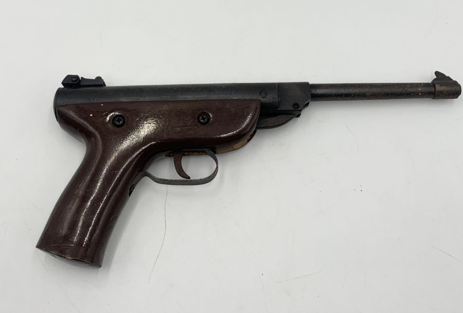A West Lake 4.5mm air pistol with wooden handle