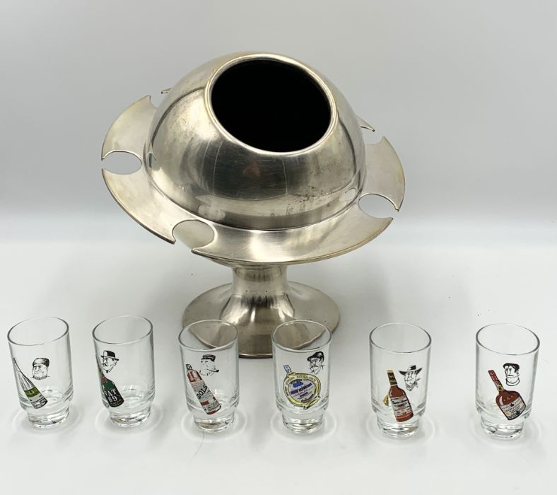 An aluminium Saturn ring ice bucket with six shot glasses