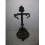 A cast iron umbrella stand.