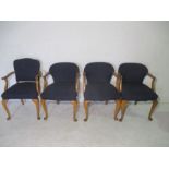 A matched set of four chairs on cabriole legs.