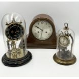 A collection of three clocks including two anniversary clocks by Schatz and Kunda