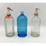 Three vintage soda syphons including a blue glass example made for Batey & Co. Ltd.