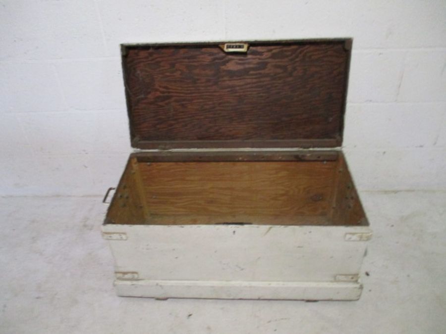 A white painted storage trunk