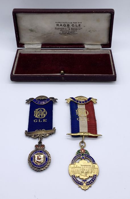 A hallmarked silver RAOB medal along with one other, both presented to Brother Woodcock, General