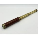 A three drawer brass telescope inscribed Gilkerson & Co. Tower Hill London Improved.