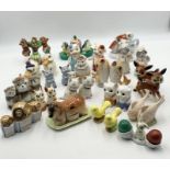 A collection of various vintage novelty salt and pepper sets mainly animal themed