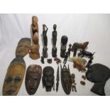 A collection of African wooden carvings and sculptures