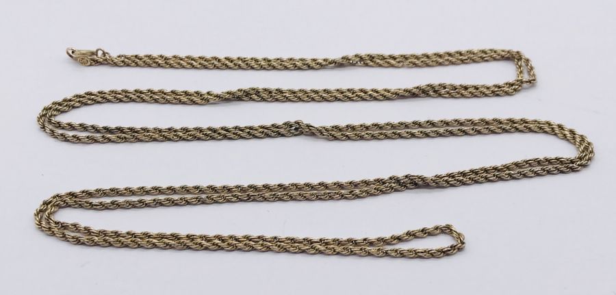 A 9ct gold long guard chain, weight 14.4g