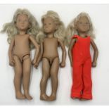 Three blonde unboxed Sasha dolls one with red jump suit