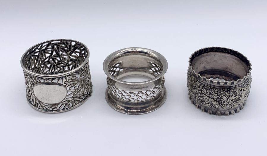 A collection of 7 hallmarked silver napkin rings along with an Australian silver plated version - Image 4 of 5