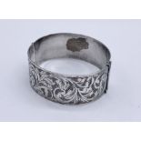 A hallmarked silver hinged bracelet