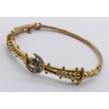 A 9ct gold Victorian bracelet set with seed pearls and sapphire in a crescent moon (1 pearl